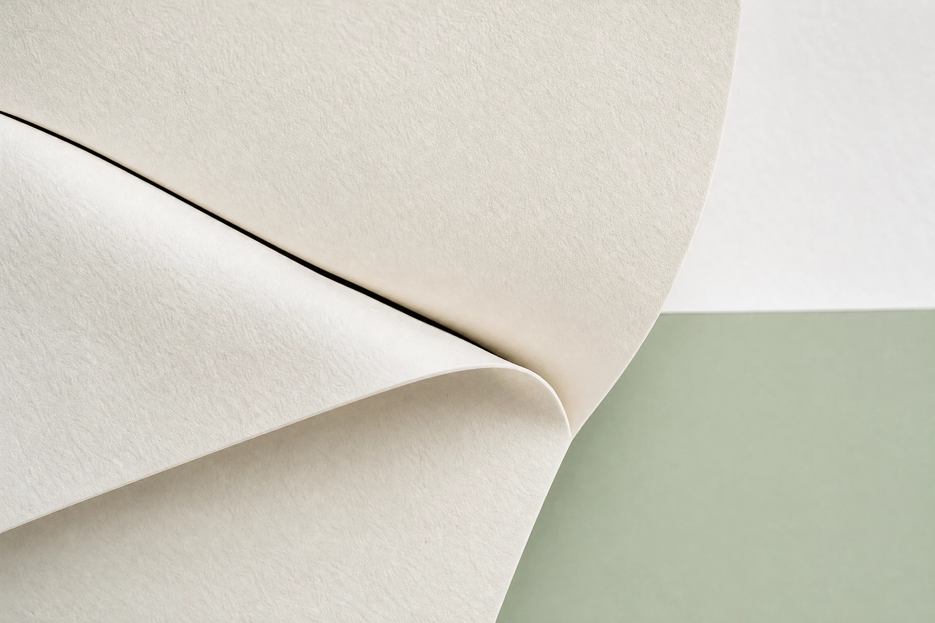 Abstract paper forms resolving into a clear sage horizon