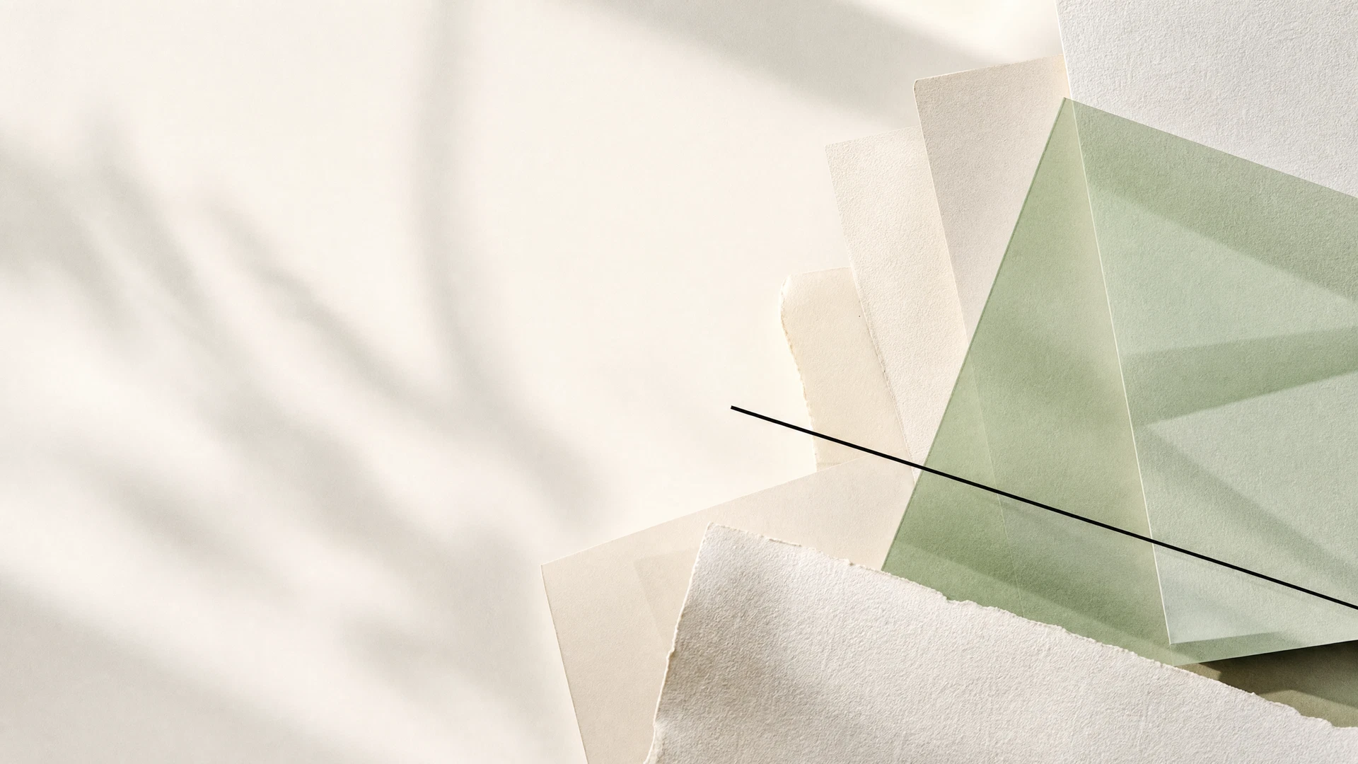 Abstract layered papers in sage, ivory, and black